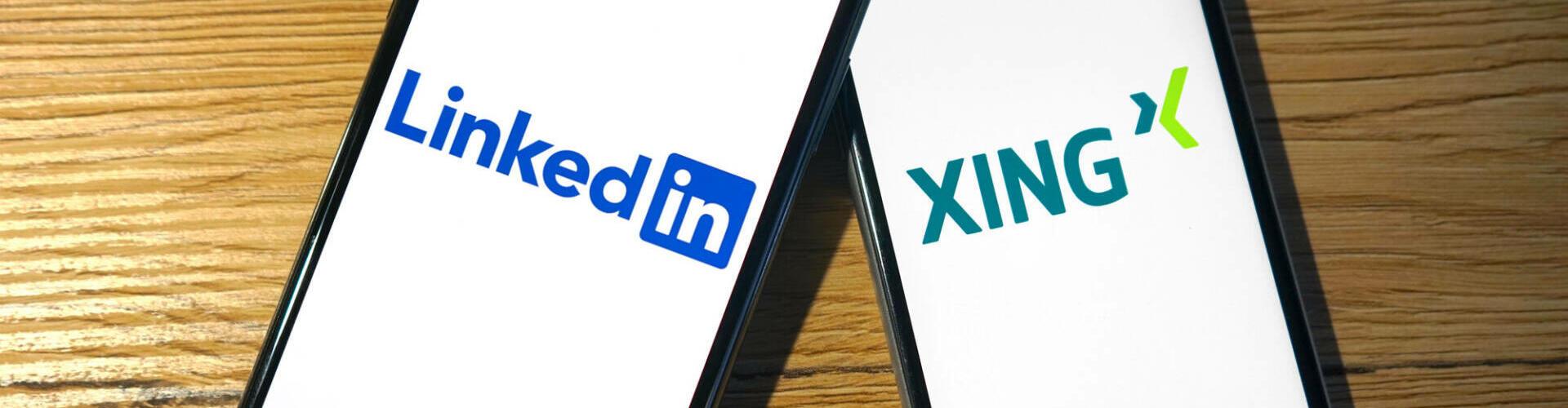 Logos von LinkedIn und Xing werden auf zwei Smartphones angezeigt